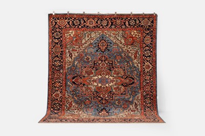 Lot 109 - A wool carpet of Heriz design