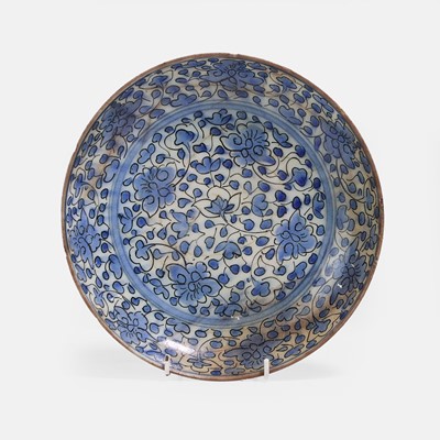 Lot 297 - A Qajar Asian-revival blue and white pottery plate