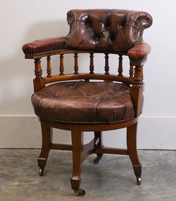 Lot 523 - A Victorian walnut revolving desk chair