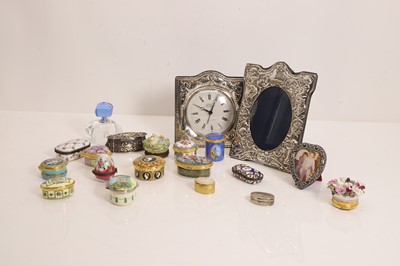 Lot 133 - A collection of enamelled and porcelain boxes and silver-mounted items