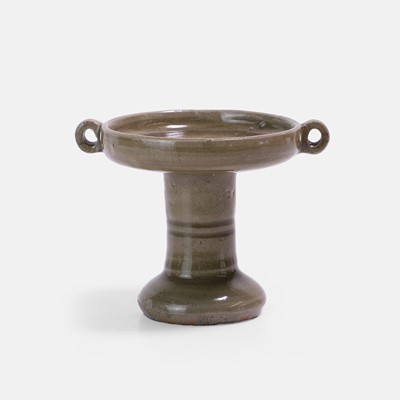 Lot 13 - A Chinese celadon-glazed oil lamp