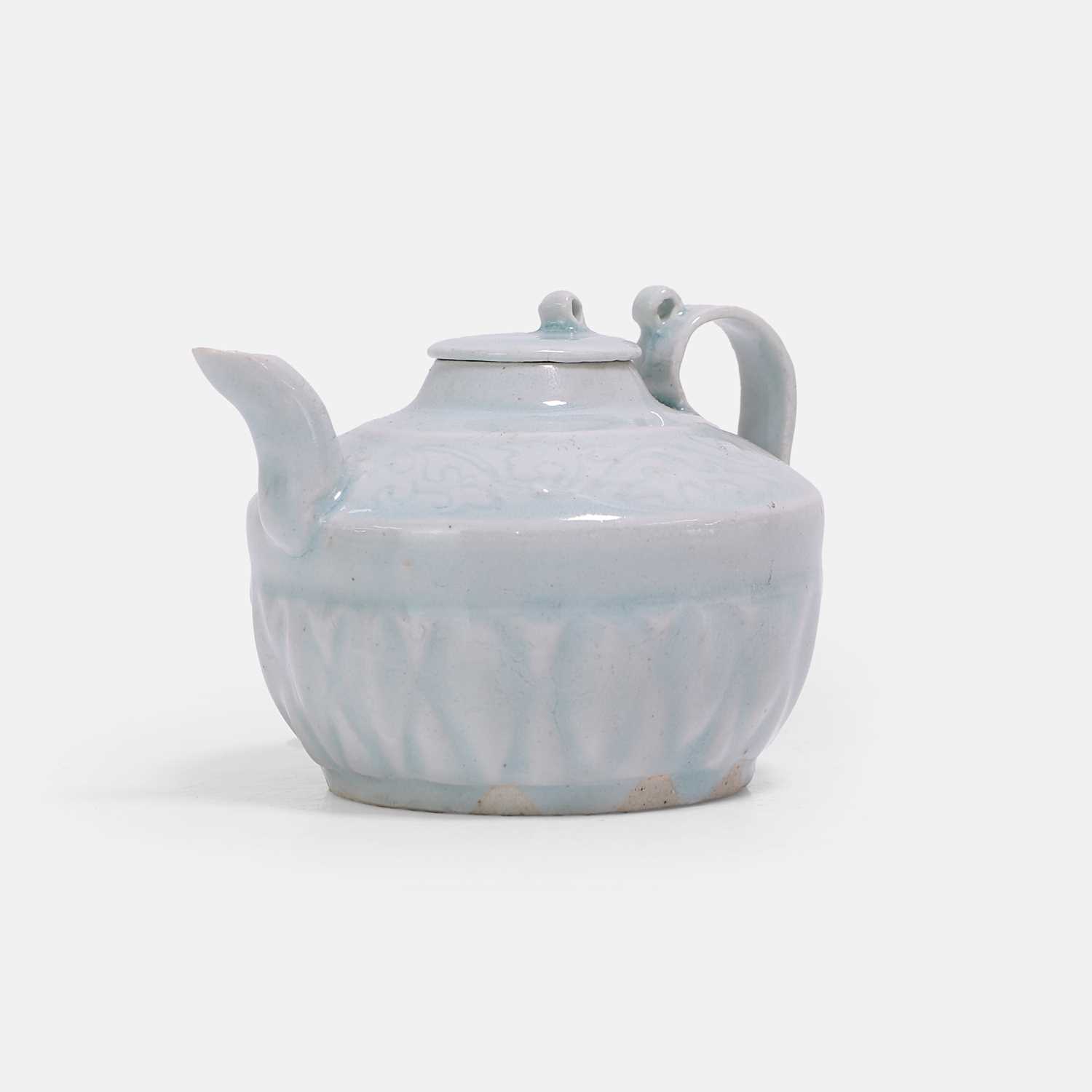 Lot 7 - A Chinese Hutian ware qingbai-glazed teapot and cover