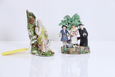 Lot 130 - A Staffordshire pearlware figural group of the 'Tithe Pig'