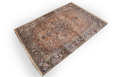 Lot 423 - A silk Kirman carpet