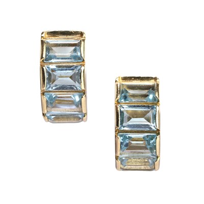 Lot 89 - A pair of 18ct gold blue topaz 'huggie' earrings