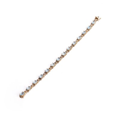 Lot 146 - A 9ct gold blue topaz and diamond bracelet