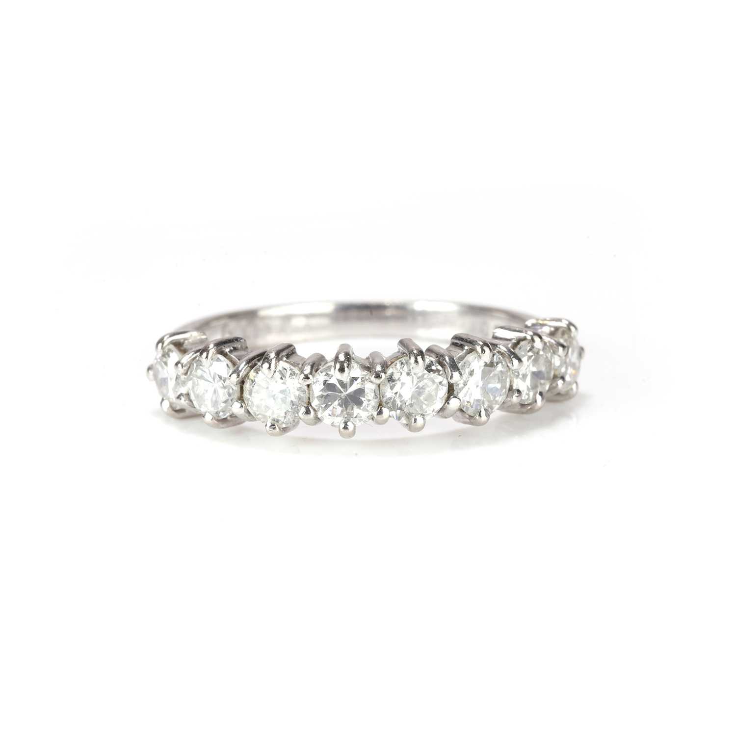 Lot 72 - An 18ct white gold diamond half eternity ring