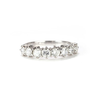 Lot 72 - An 18ct white gold diamond half eternity ring