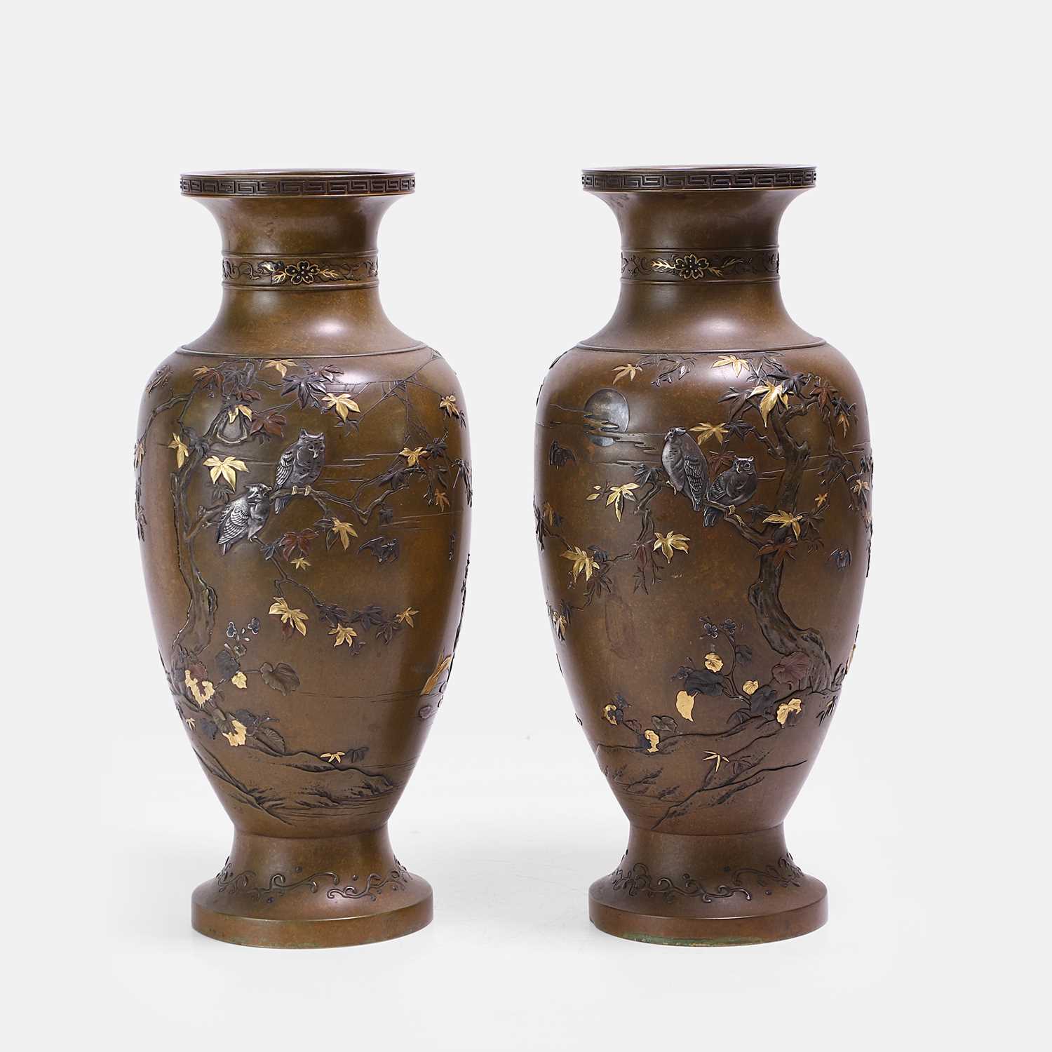 Lot 340 - A pair of Japanese mixed-metal-inlaid bronze vases