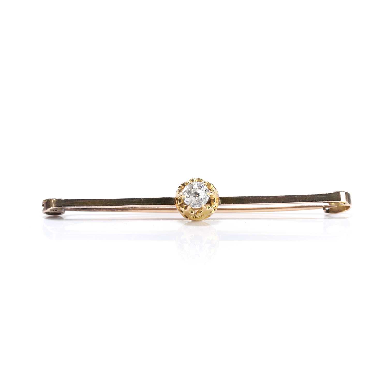 Lot 47 - A diamond set bar brooch