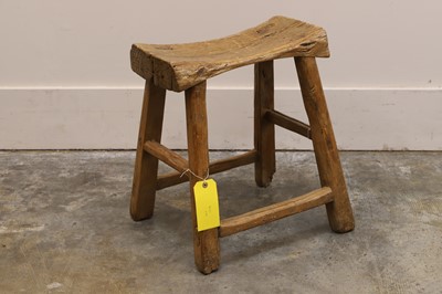 Lot 549 - An elm stool