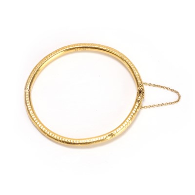 Lot 60 - An engraved bangle