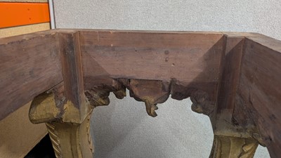 Lot 9 - A George II carved giltwood side table in the manner of William Kent