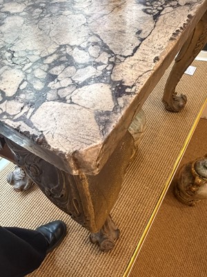 Lot 9 - A George II carved giltwood side table in the manner of William Kent
