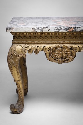 Lot 9 - A George II carved giltwood side table in the manner of William Kent