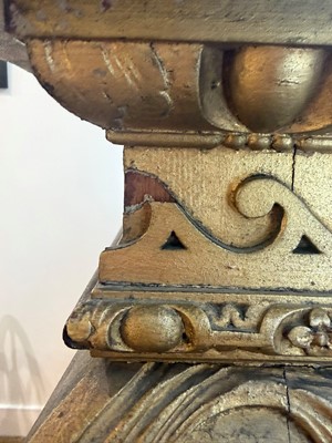 Lot 9 - A George II carved giltwood side table in the manner of William Kent