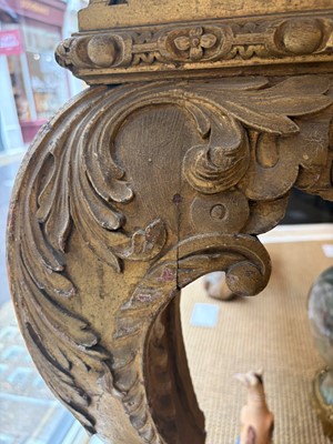 Lot 9 - A George II carved giltwood side table in the manner of William Kent