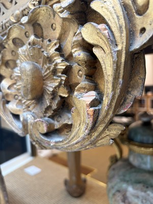 Lot 9 - A George II carved giltwood side table in the manner of William Kent