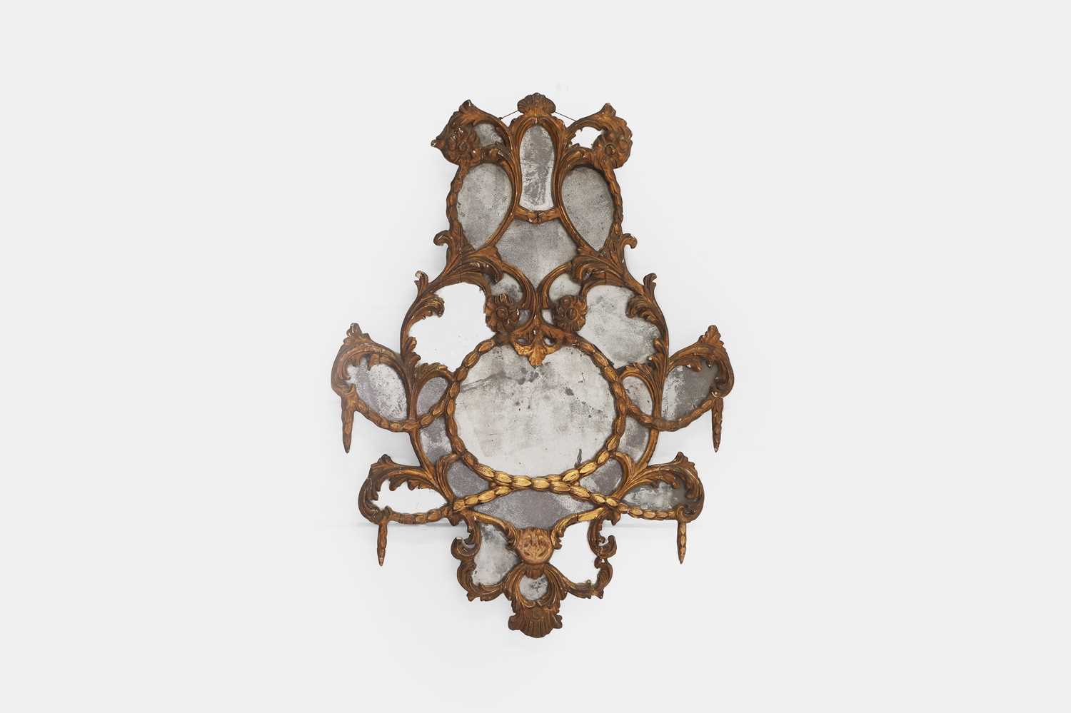 Lot 14 - A carved giltwood and carton pierre pier mirror