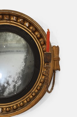 Lot 11 - A small Regency giltwood convex mirror
