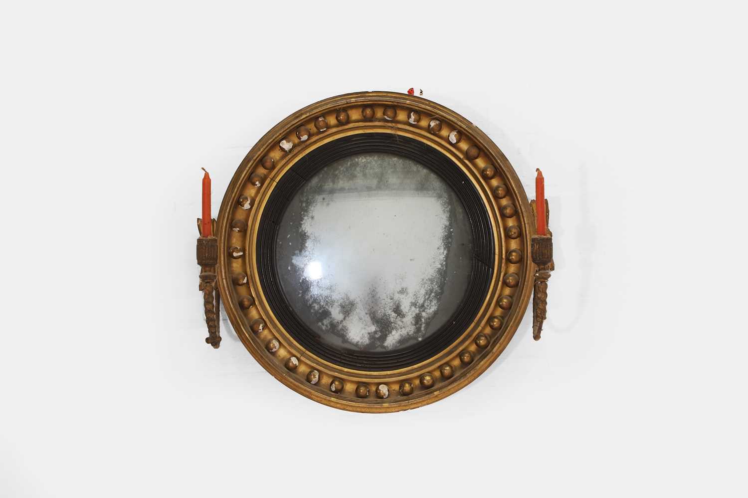 Lot 11 - A small Regency giltwood convex mirror