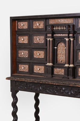 Lot 20 - A baroque ebonised fruitwood, rosewood, ivory and bone cabinet