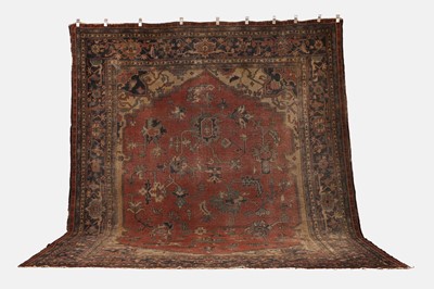 Lot 592 - A Persian Heriz wool carpet