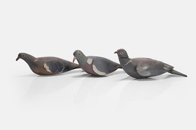 Lot 128 - A flight of three wooden decoy pigeons