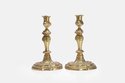 Lot 79 - A pair of Louis XV ormolu candlesticks