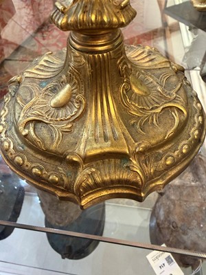 Lot 79 - A pair of Louis XV ormolu candlesticks