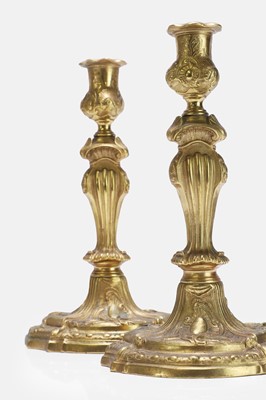 Lot 79 - A pair of Louis XV ormolu candlesticks