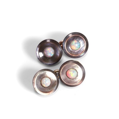 Lot 377 - A pair of similar mother of pearl and opal cufflinks