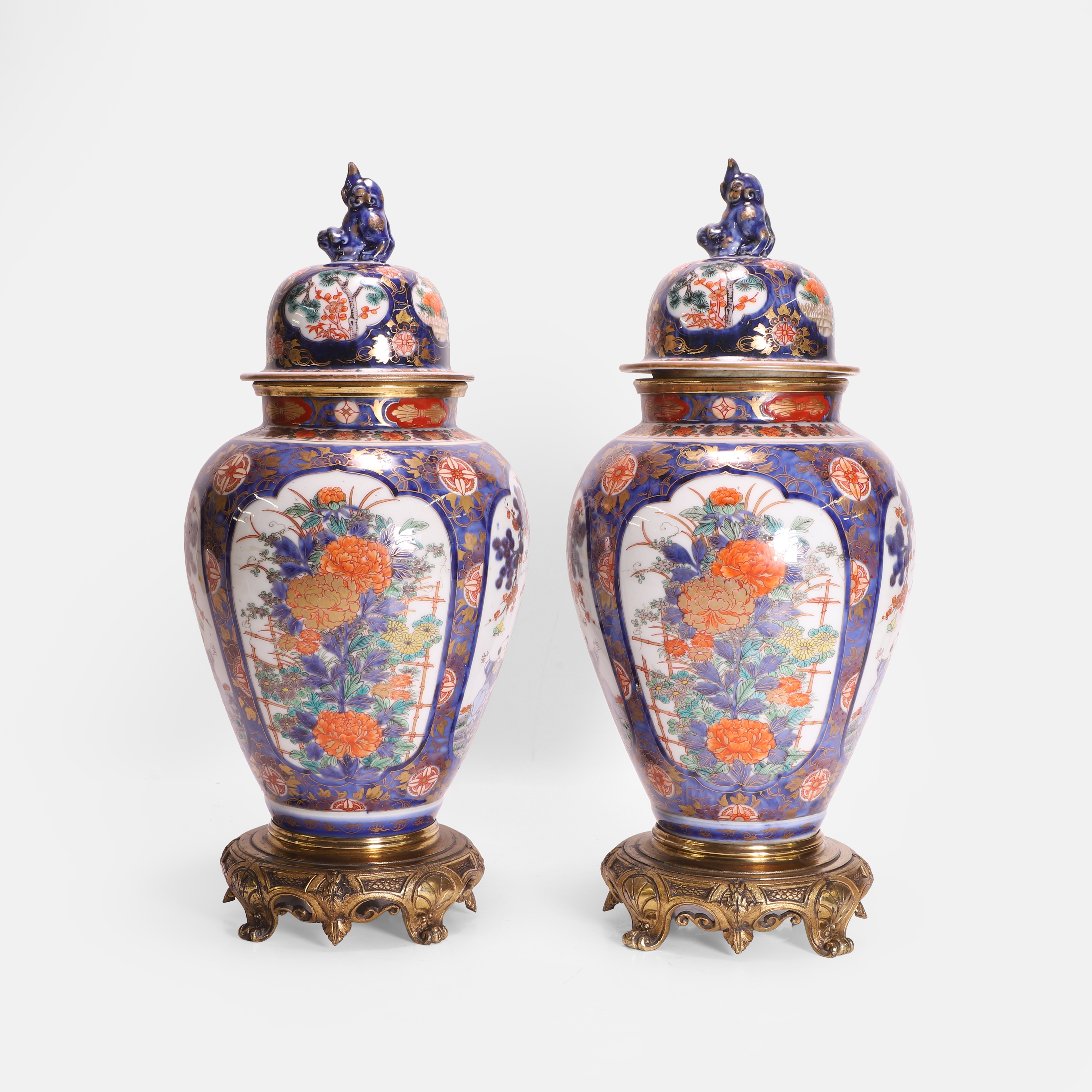 Lot 429 - A pair of Japanese Imari vases and covers,