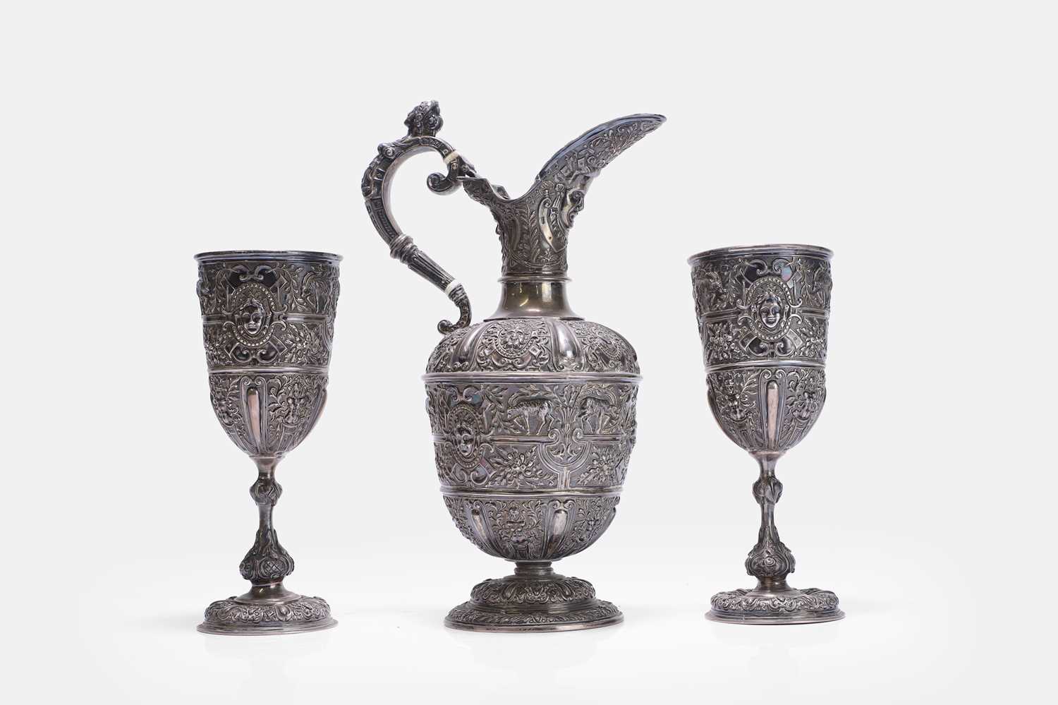 Lot 17 - A Victorian silver 'Cellini' pattern ewer and two goblets