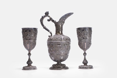 Lot 17 - A Victorian silver 'Cellini' pattern ewer and two goblets