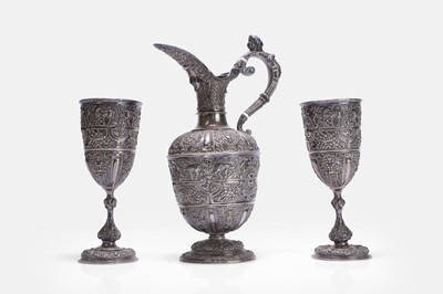 Lot 17 - A Victorian silver 'Cellini' pattern ewer and two goblets