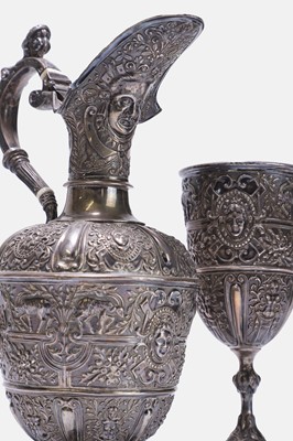 Lot 17 - A Victorian silver 'Cellini' pattern ewer and two goblets