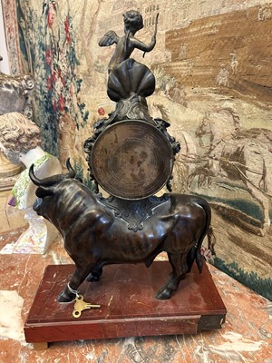 Lot 12 - A Louis XV-style patinated bronze mantel clock