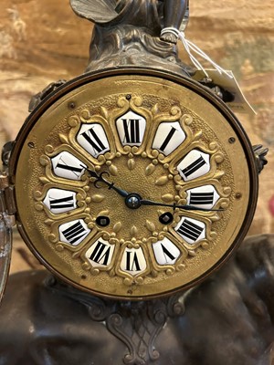 Lot 12 - A Louis XV-style patinated bronze mantel clock