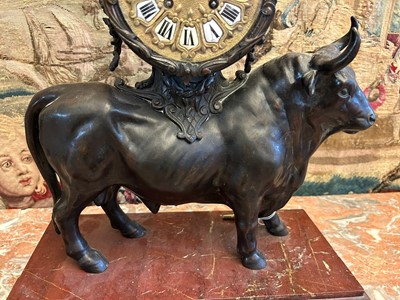 Lot 12 - A Louis XV-style patinated bronze mantel clock