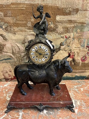Lot 12 - A Louis XV-style patinated bronze mantel clock