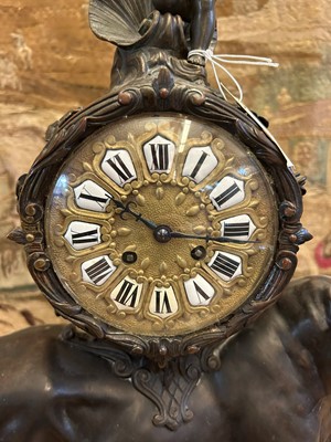 Lot 12 - A Louis XV-style patinated bronze mantel clock