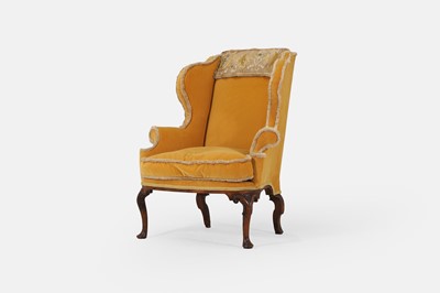 Lot 216 - A George I upholstered wing armchair