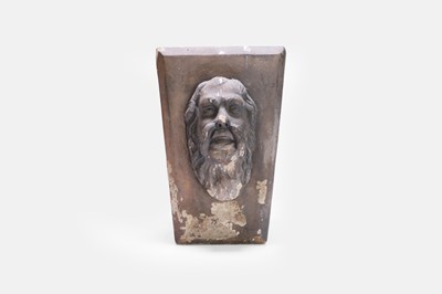 Lot 640 - A Victorian blush terracotta keystone in the manner of Coade