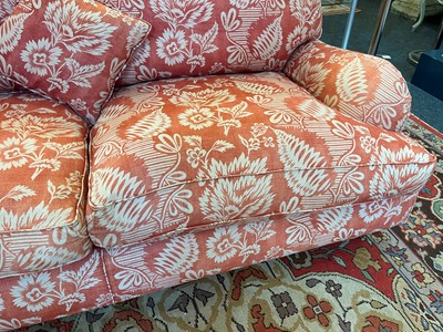 Lot 42 - A pair of upholstered sofas in the manner of Howard and Sons