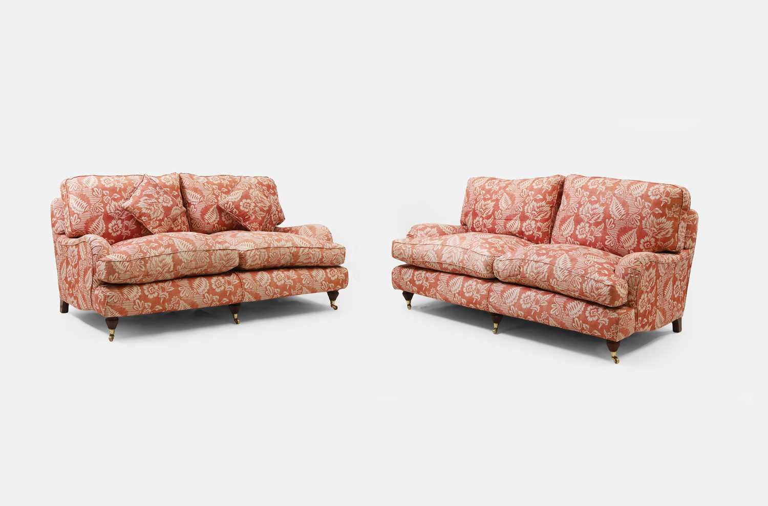 Lot 42 - A pair of upholstered sofas in the manner of Howard and Sons