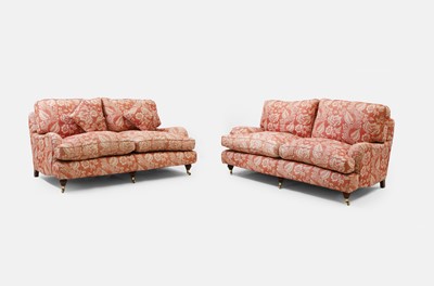 Lot 42 - A pair of upholstered sofas in the manner of Howard and Sons