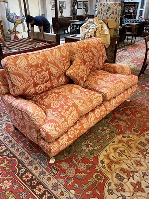 Lot 42 - A pair of upholstered sofas in the manner of Howard and Sons