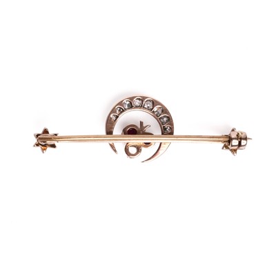 Lot 40 - A late Victorian diamond and gemstone set crescent bar brooch