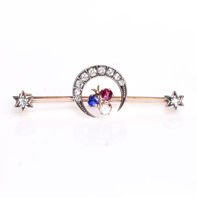 Lot 40 - A late Victorian diamond and gemstone set crescent bar brooch